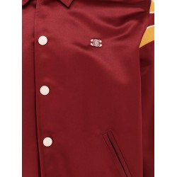 Satin bomber with enamelled snap buttons, striped ribbed inserts and triomphe embroidery
