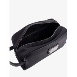 Leather beauty case with metal logo patch