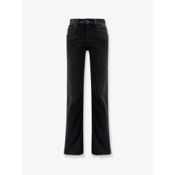 Denim trousers with frayed edges