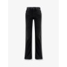 Denim trousers with frayed edges