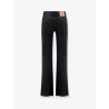 Denim trousers with frayed edges