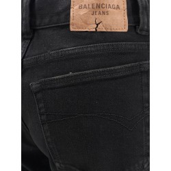 Denim trousers with frayed edges