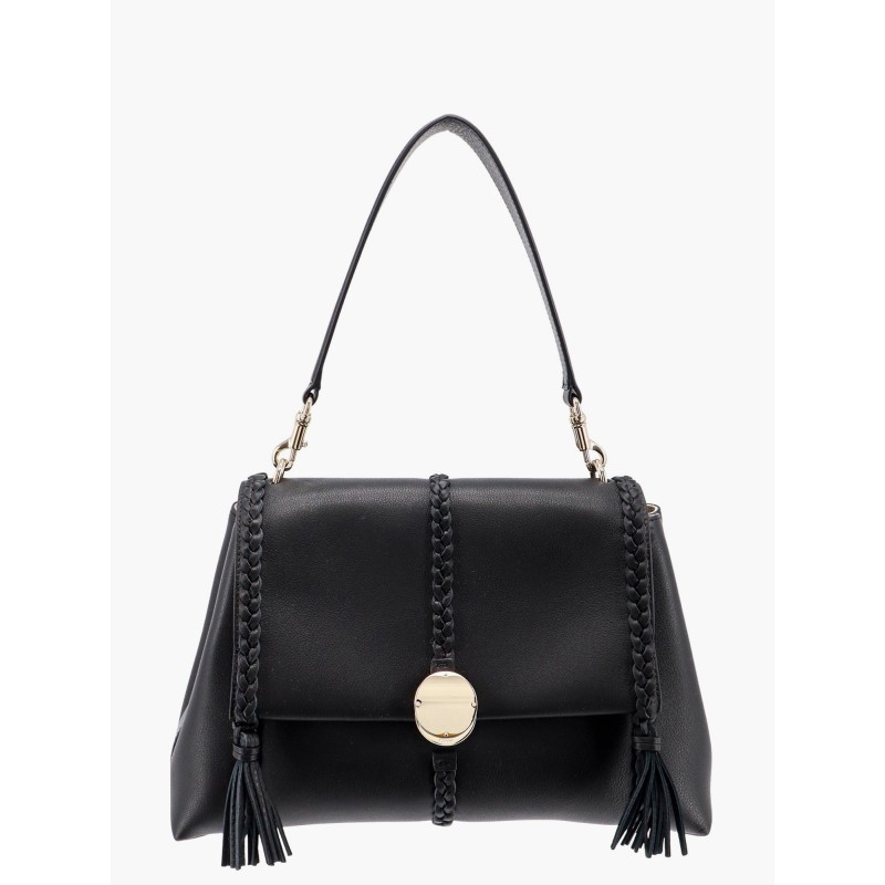 Leather shoulder bag with tassels