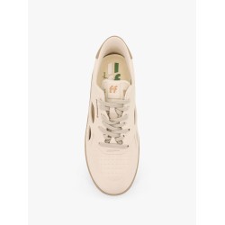 Low-top sneakers realized with foam with lateral openwork