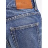 Jeans with leather logo tag