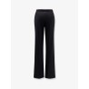 Trousers with double logoed button