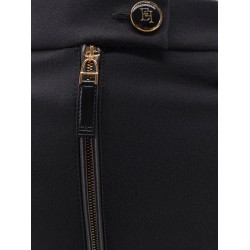Trousers with logoed button