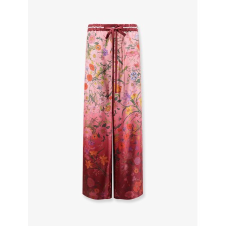 Silk trousers with Gucci Flora print