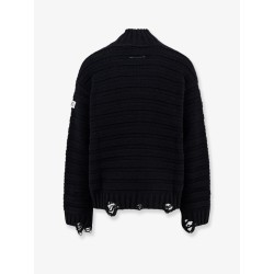 Wool blend sweater with distressed effect