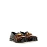 MOCCASIN WITH BANGS AND COIN
