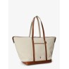 Canvas travel bag with leather profiles