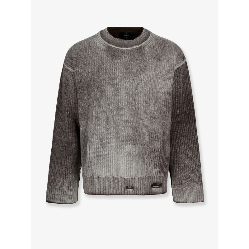 Reversible wool sweater with destroyed effect
