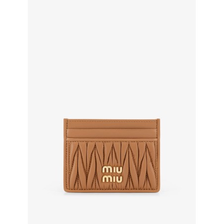 Quilted leather card holder with metal lettering logo