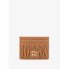 Quilted leather card holder with metal lettering logo