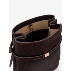 Pony skin shoulder bag with strap on the front