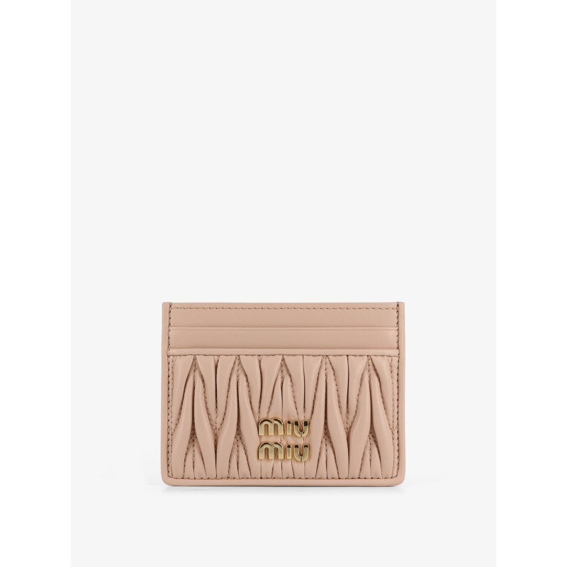 Quilted leather card holder with metal lettering logo