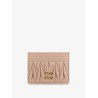 Quilted leather card holder with metal lettering logo