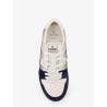 Match leather sneakers with suede inserts