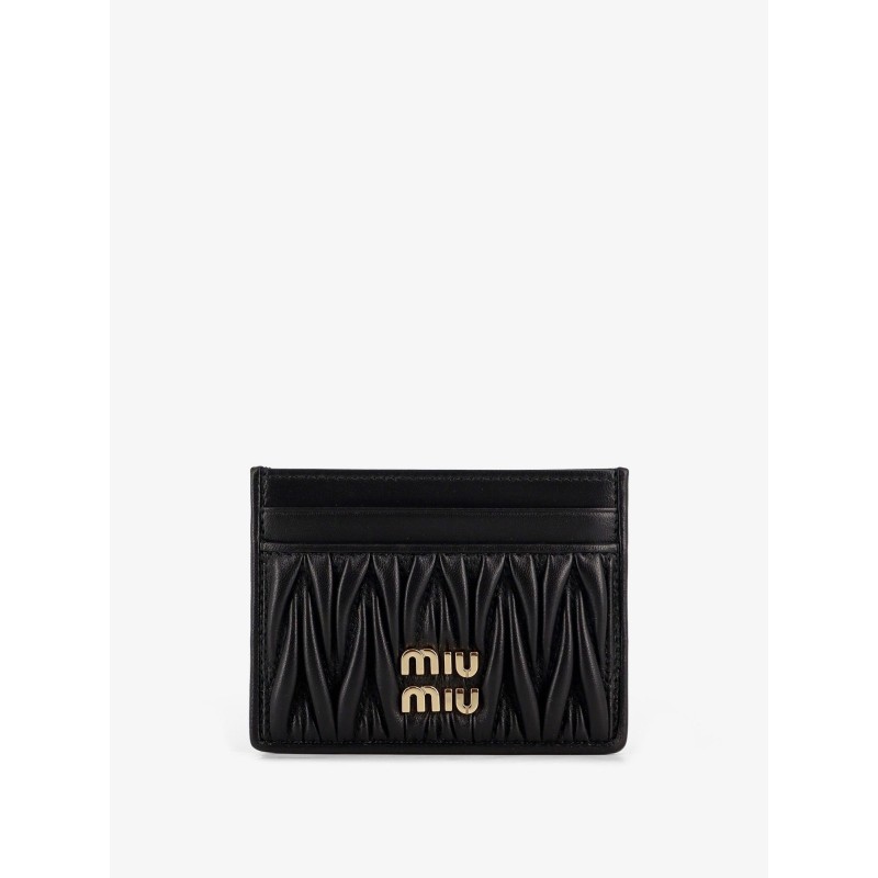 Quilted leather card holder with metal logo