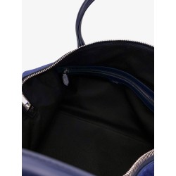 Suede travel bag with engraved logo on the front