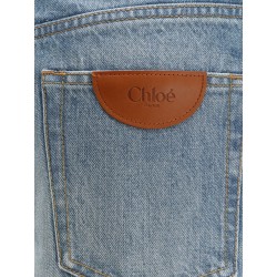 Blue denim jeans with logo label on the back