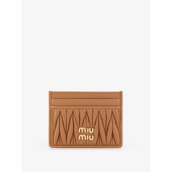 Quilted leather card holder with metal lettering logo