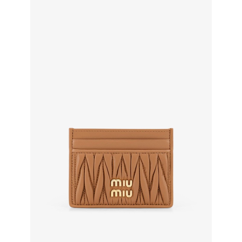 Quilted leather card holder with metal lettering logo