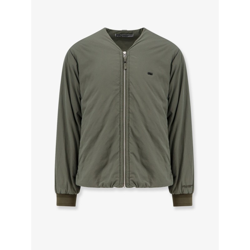 Nylon jacket with metal logo patch on the front