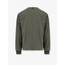 Nylon jacket with metal logo patch on the front