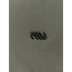 Nylon jacket with metal logo patch on the front