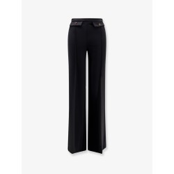 Trousers with double logoed button