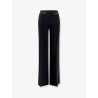 Trousers with double logoed button