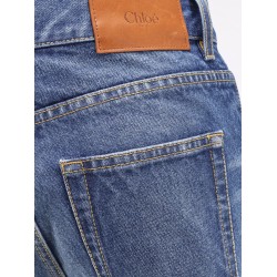 Jeans with leather logo tag
