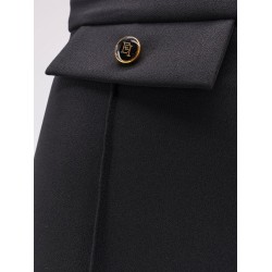 Trousers with double logoed button